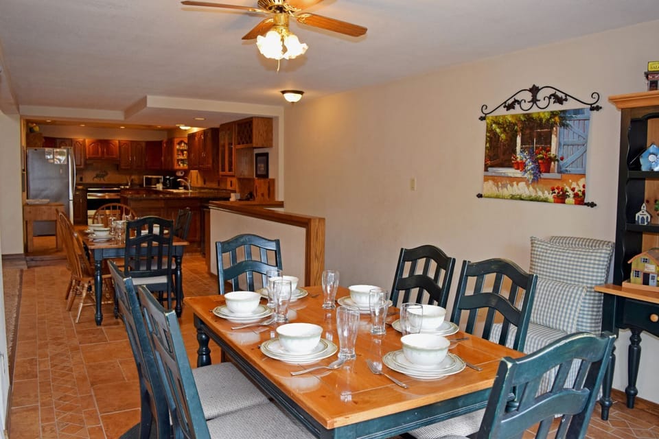 Gather around your spacious dining table set for memorable meals, with a fully-equipped kitchen ready for your culinary adventures. Ceiling fan ensures comfort while you enjoy quality time together.