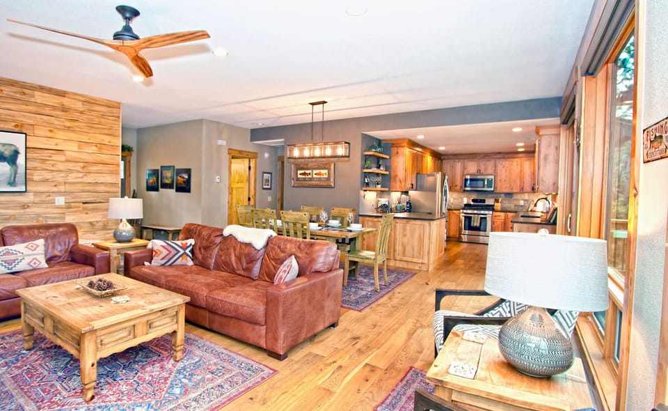 Living room view to kitchen and dining table