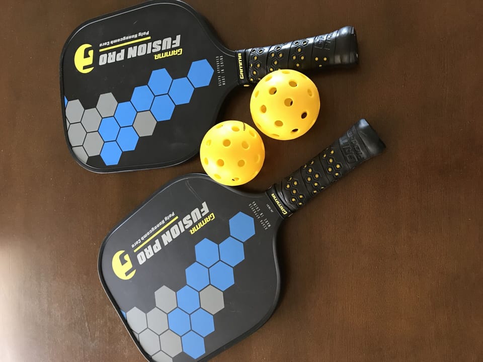 Pickle Ball paddles and tennis gear in condo!