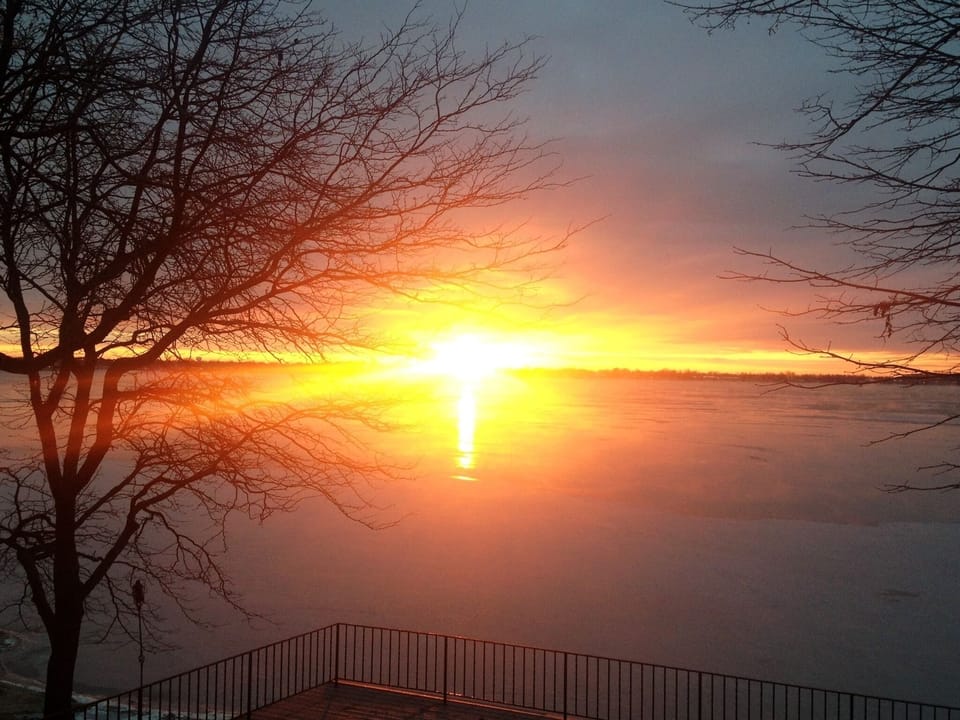 Sunrise over the freezing lake in December-truly beautiful during every season!