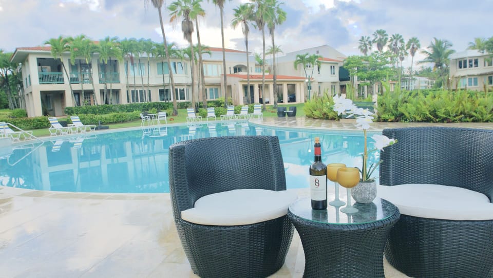 Plenty of seating by the pool and shaded clubhouse