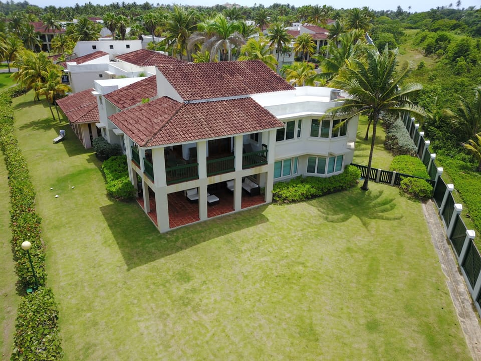 BIrds eye view of of this gated community and gardens near the beach.