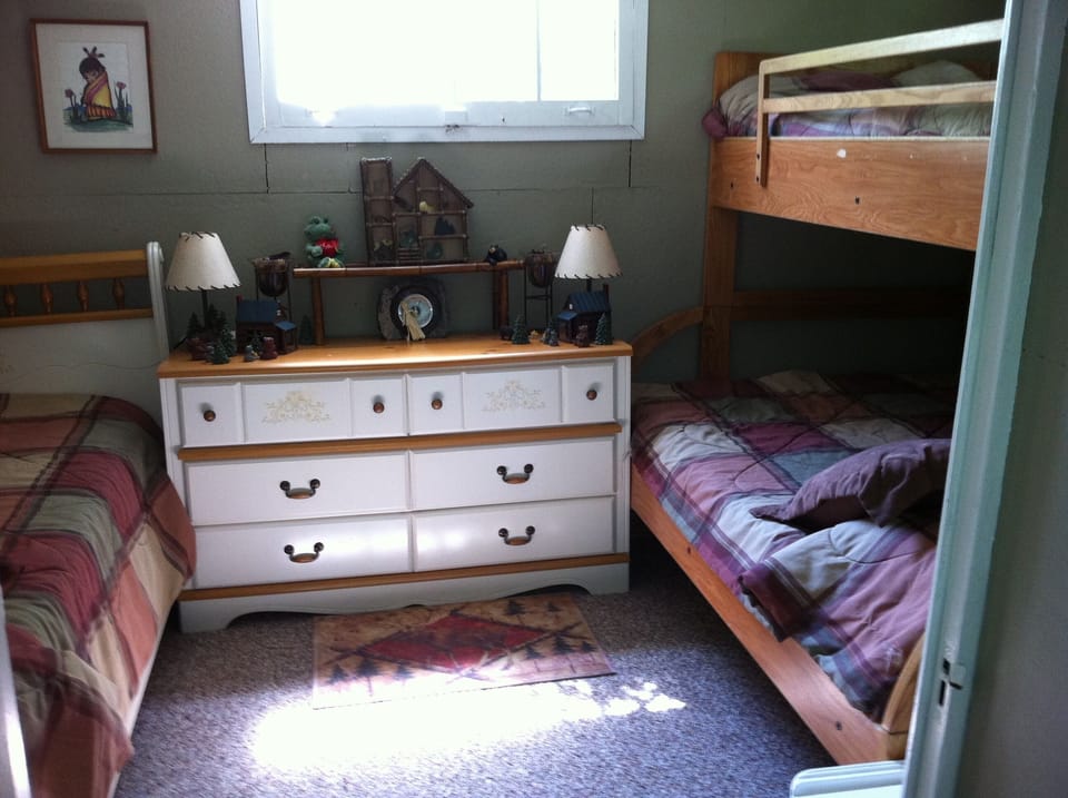 2nd bedroom with twin bed and bunkbeds
