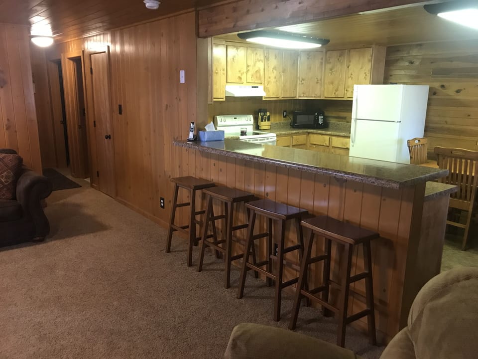 Pass through bar with seating for 4