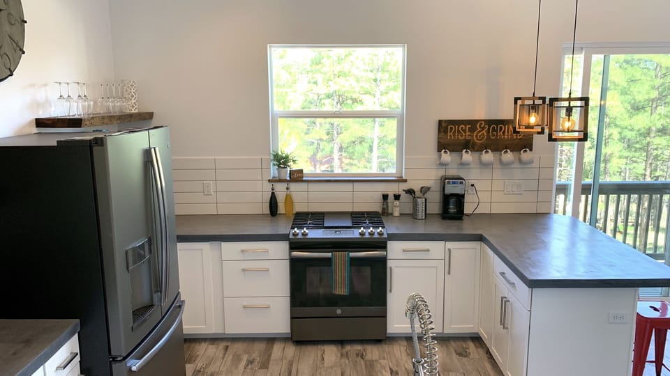 Open Kitchen with high end GE Appliances.