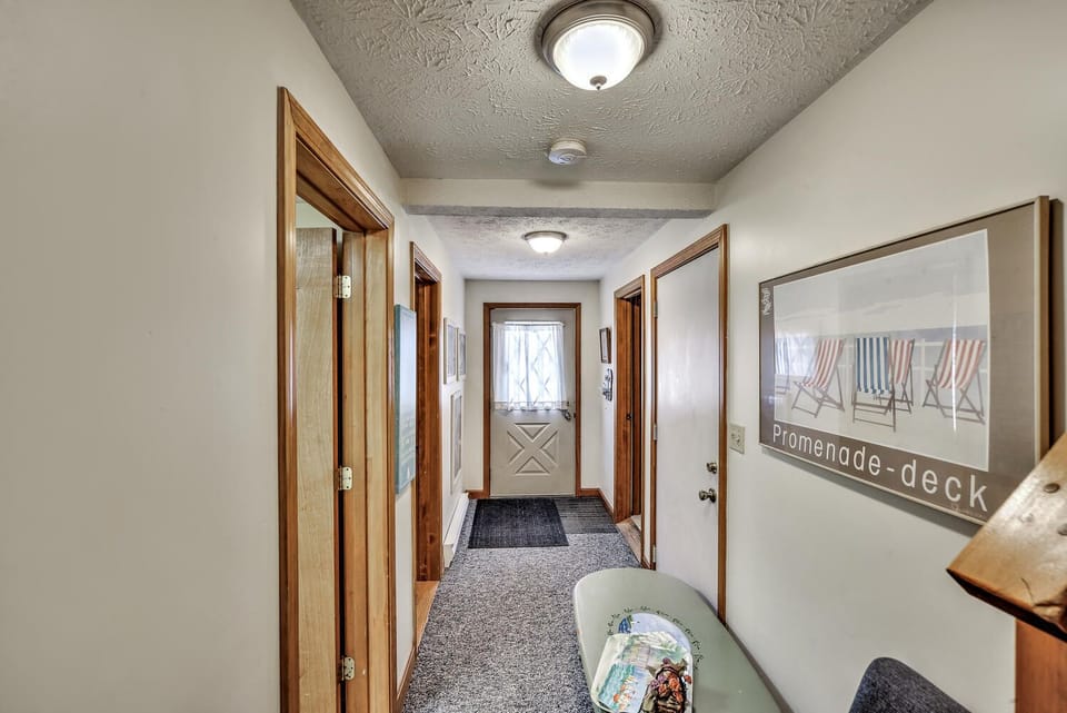View of ground/first floor hallway from staircase 