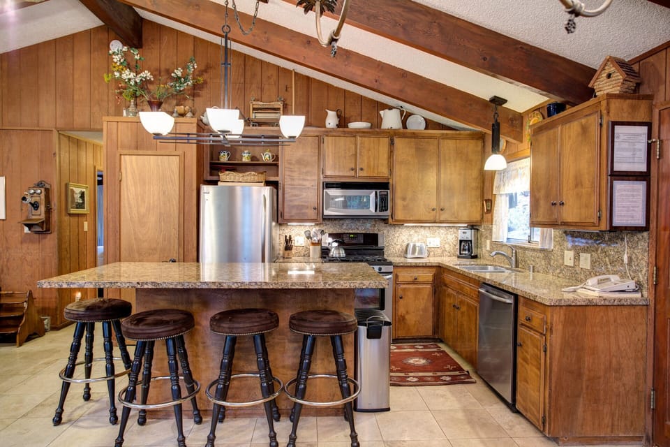 Kitchen with granite counter tops, stainless steel appliances - main floor