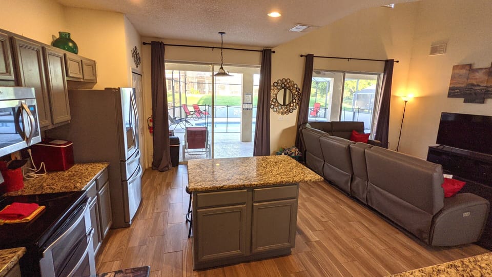 New granite countertops in an open concept area where you can cook and hang out.
