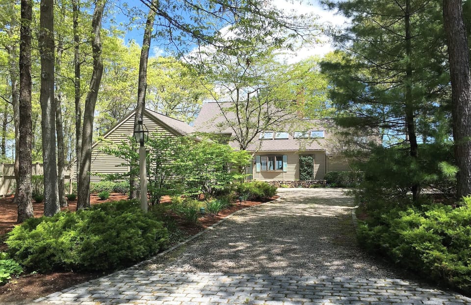 Beautiful Waterfront home with two car garage, private drive & plenty of parking