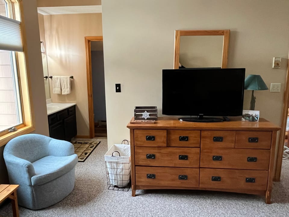 Second floor bedroom. Gaming TV. Gaming console not provided.