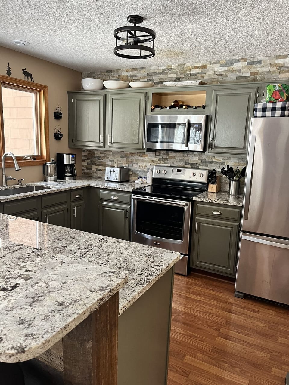 Kitchen has coffee maker, dishwasher, coffee filters, microwave, etc.