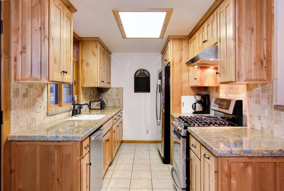 Kitchen with granite countertops and stainless steel appliances