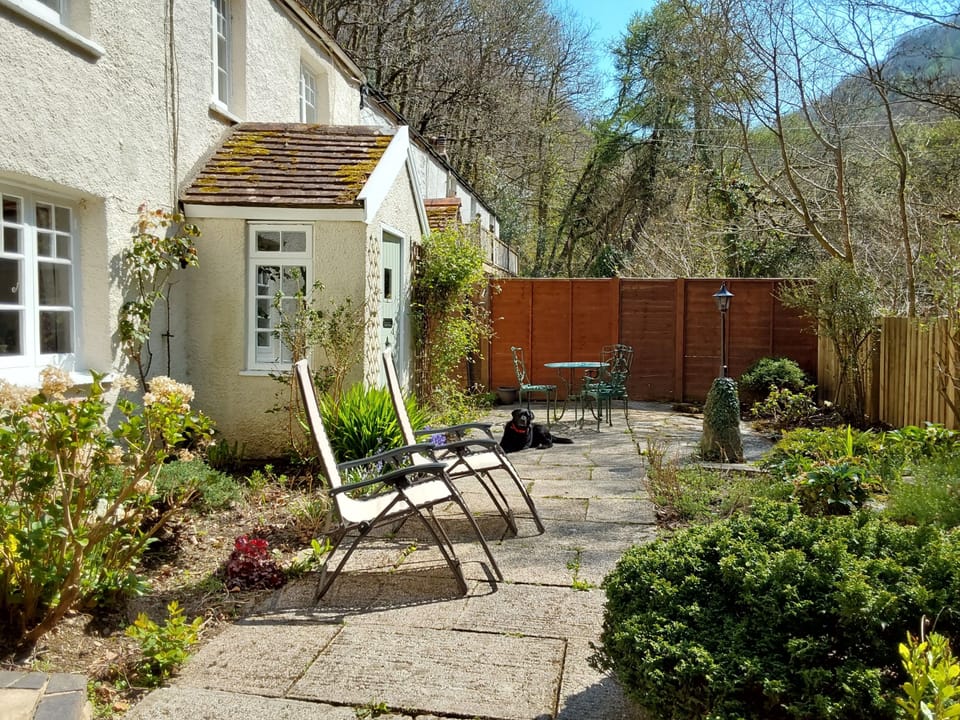 The front garden with plenty of seating and deckchairs provided