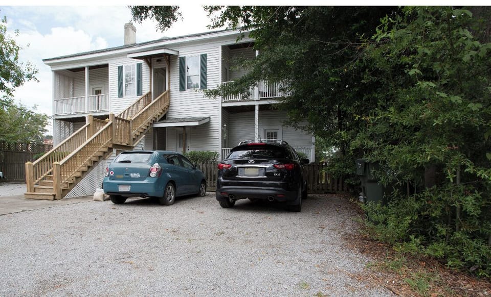 One (1) assigned parking spot on the Lane in back. Stairs up to the unit.