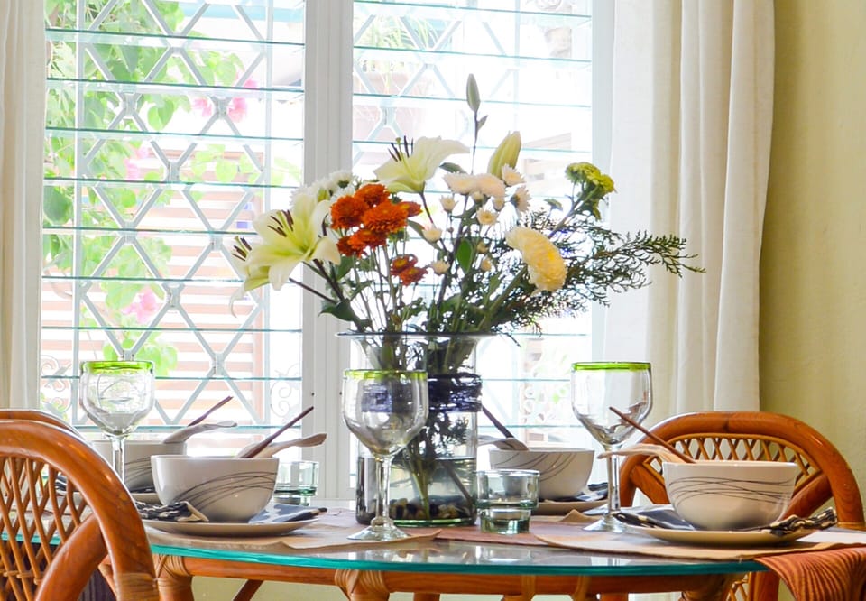 Dine inside with a view of the front garden.
