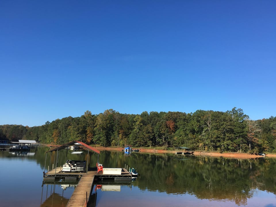 Our covered dock has a sun deck and swim ladder.