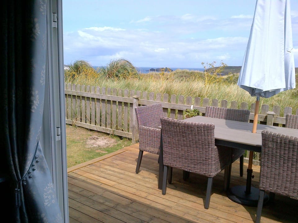 Decking area overlooks the dunes to the lighthouse, perfect for alfresco dining