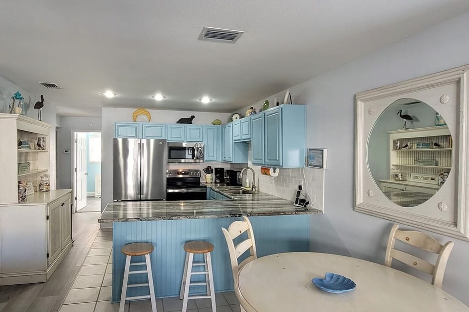 Hutch for storing groceries, stainless steel appliances and updated surfaces for a great, well-equipped kitchen