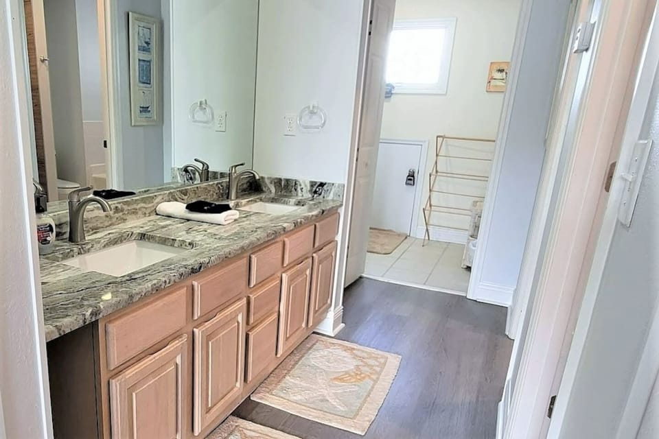 Start your morning at the granite double sink vanity in the king suite — plenty of room for two.