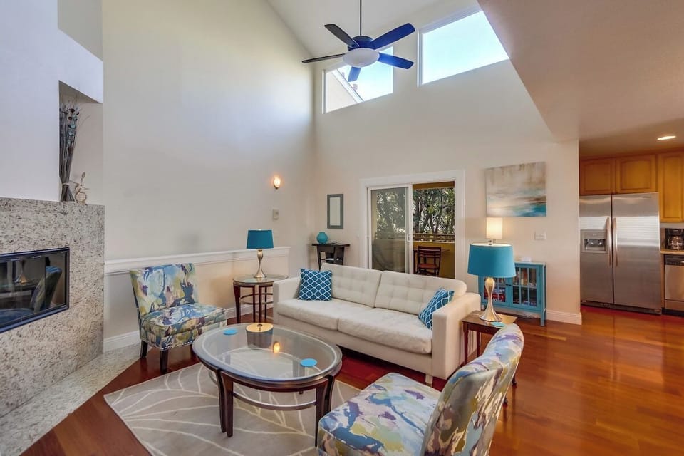 Open floor plan with dining area, living room, and kitchen. NEW sofa features a double futon bed, photos coming soon!