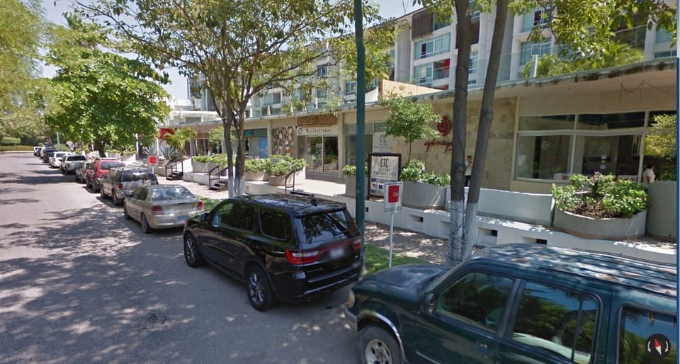 Restaurant Row. About 5 minute walk East of the house. OXXO 1 minute further.