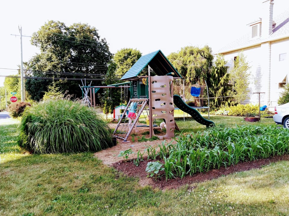 Child-friendly play area, fire pit and gardens.