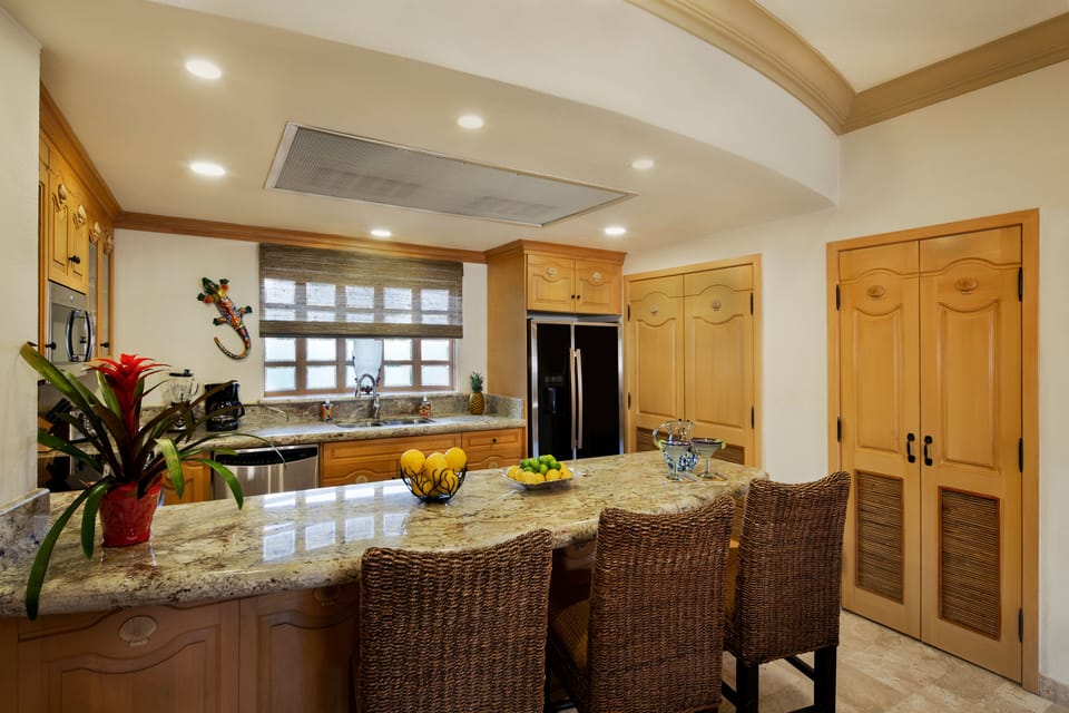 Kitchen showing laundry area and large pantry.