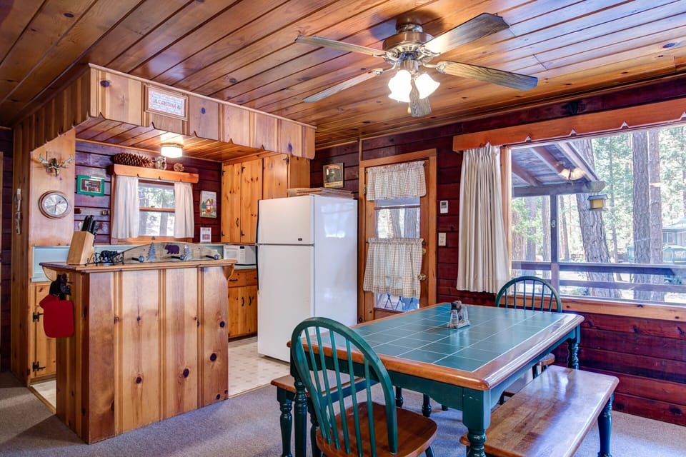 Kitchen, dining and door leading to front deck