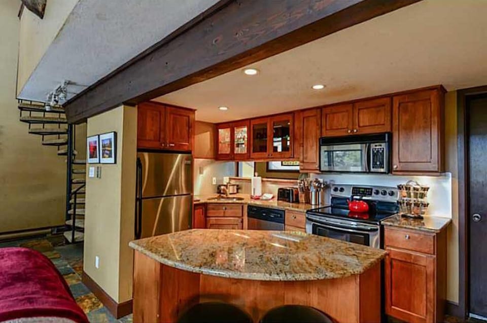 Fully stocked kitchen has stove, oven, crockpot, & all pots/pans/utensils needed