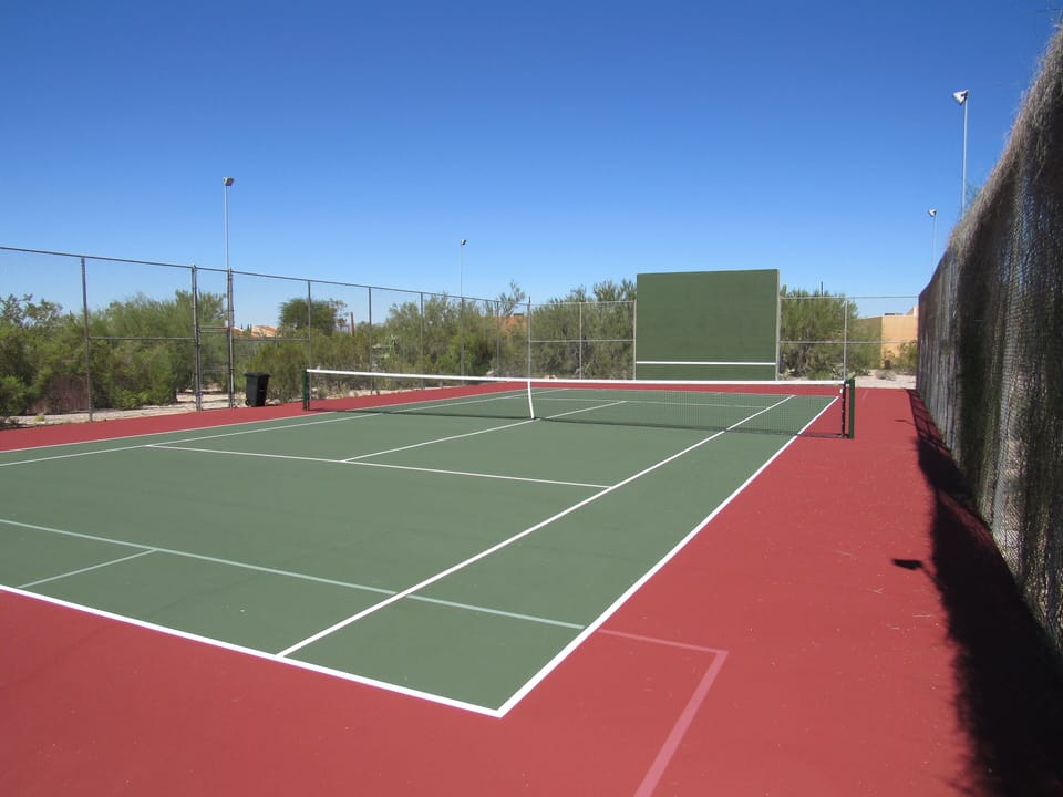 Private tennis court. Unobtrusively lined for Pickleball  on each end. 
