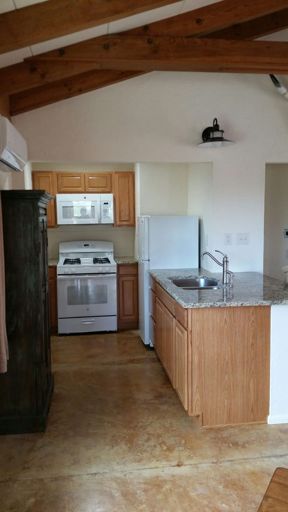 Kitchen with washer and dryer.