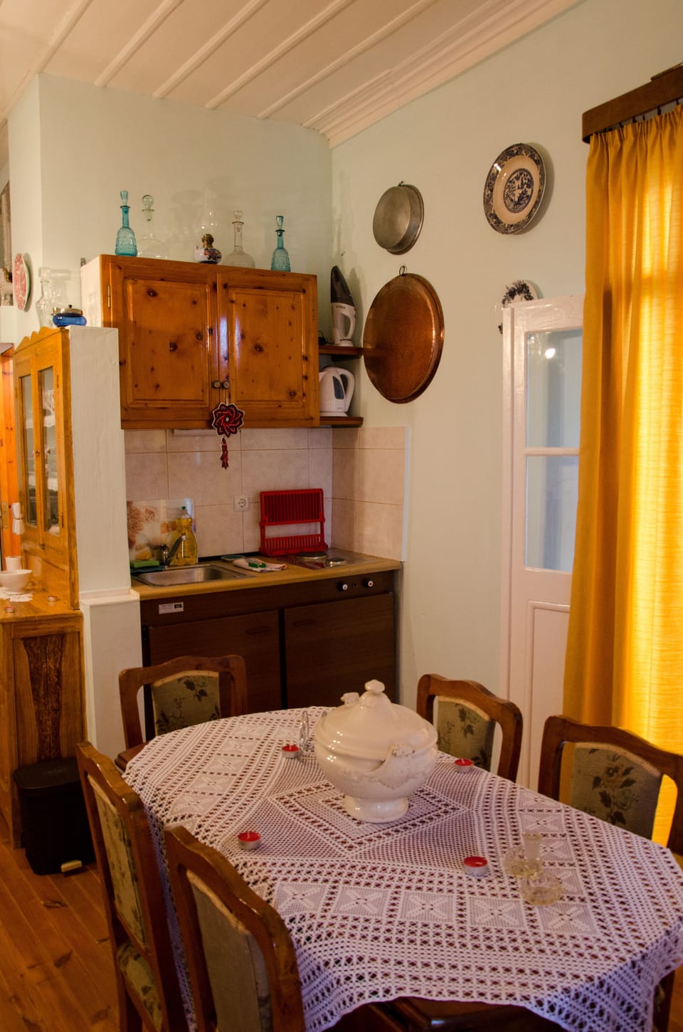2nd floor:old traditional dining table and the kitchenette with a mini-fridge bar