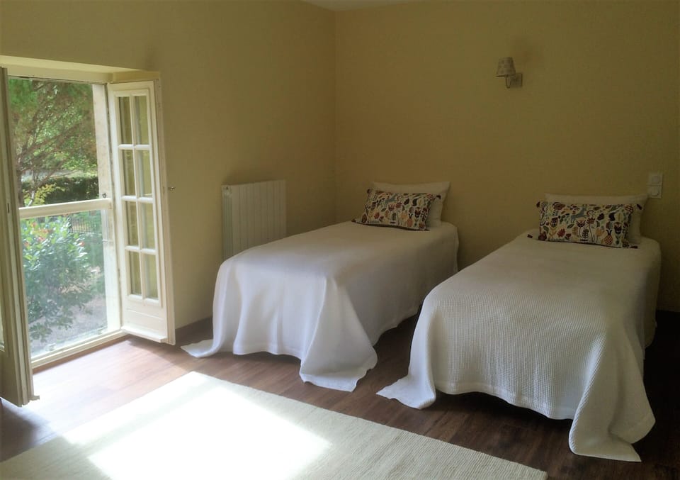 Upstairs twin/super king with ensuite, view over garden and a large wooden cot