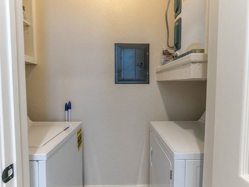 Full Size Washer and Dryer located in a room off the Kitchen