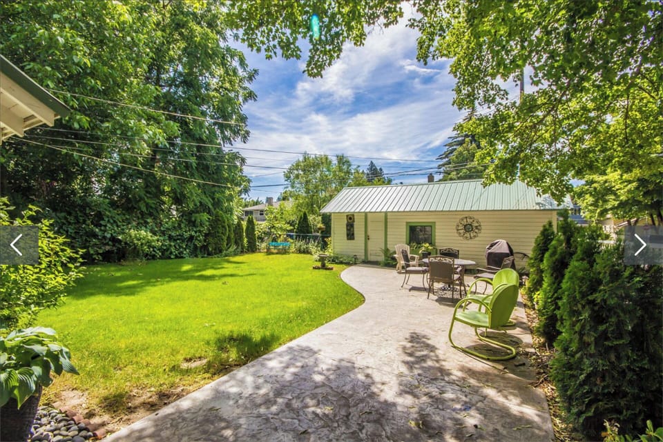 Backyard with Barbecue, fire pit and lots of seating.