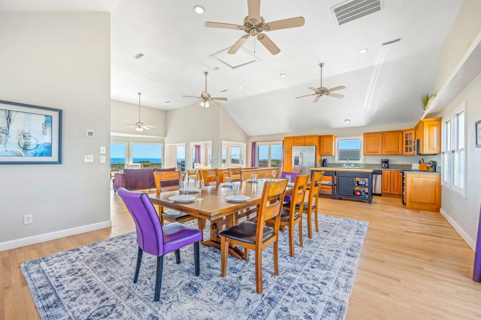 Gather around your spacious dining table where meals become memories, with sweeping views and a fully-equipped kitchen nearby for effortless entertaining.