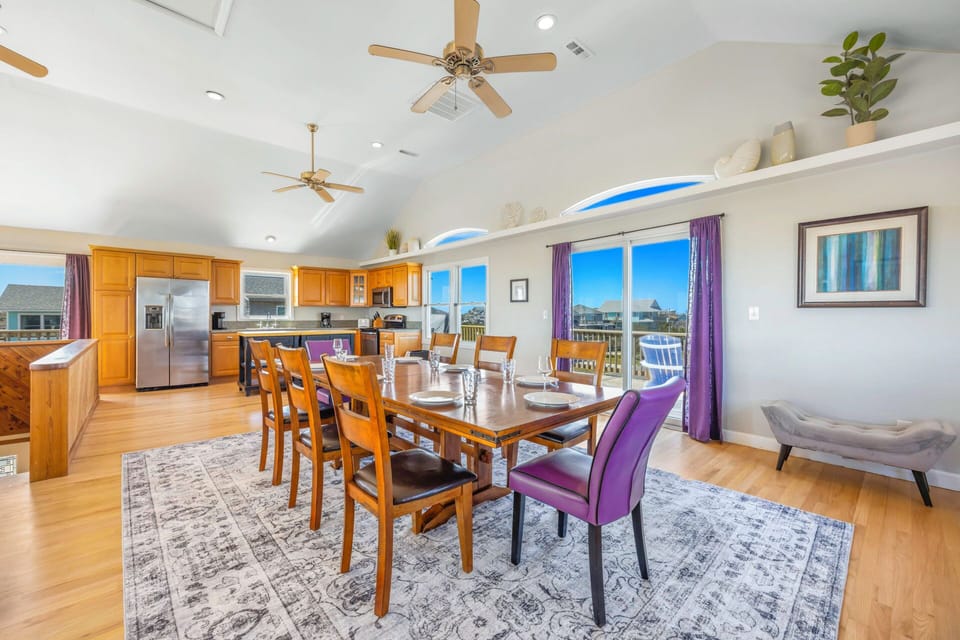 Your spacious open-concept kitchen flows seamlessly into the dining area, where natural light streams through large windows as you gather for memorable meals.