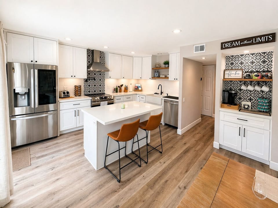 Modern, fully equipped kitchen with spacious island and seating