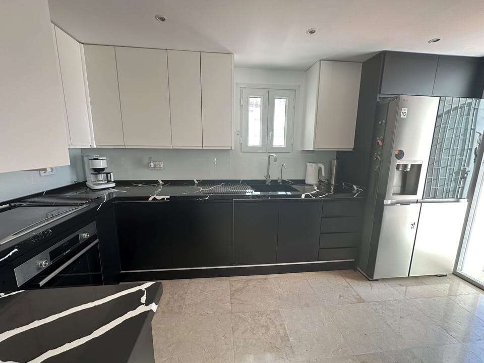 Recently renovated German kitchen with our large American fridge and ice maker.