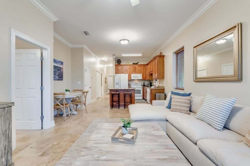- Open concept design connects kitchen, dining, and living in one welcoming space - Granite counters, warm wood cabinetry, and soft neutrals create a relaxed flow - Ideal for entertaining, movie nights, or sharing stories over snacks