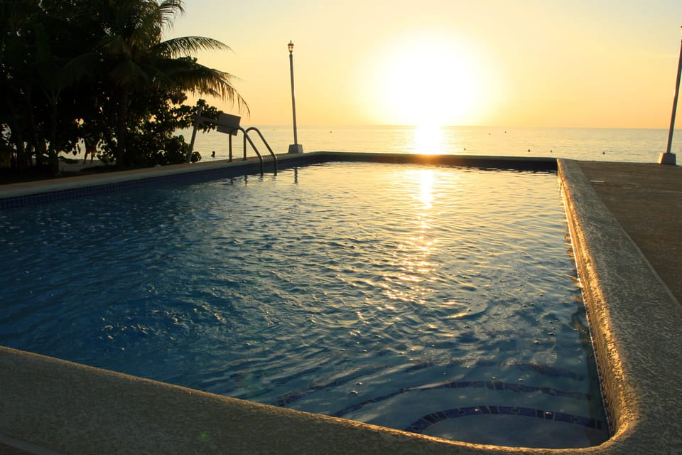 Enjoy fabulous sunsets sitting in the pool