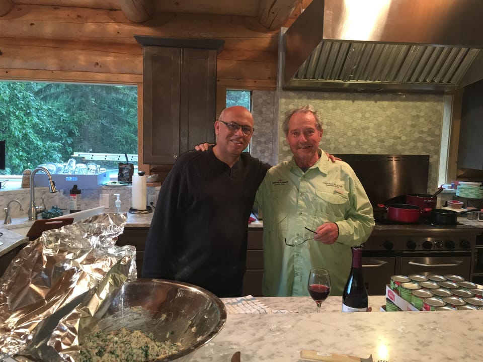 Guests with owner enjoying the commercial yet gourmet kitchen.                