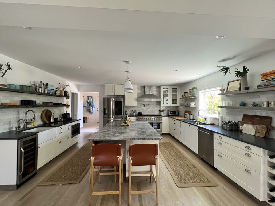 Chefs kitchen with white shaker cabinets