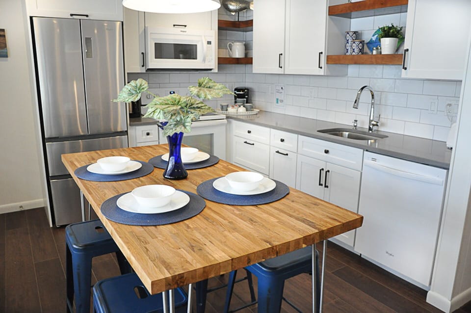 Gather round the table in open concept kitchen & living room. 