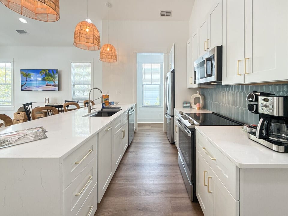 Brand-new kitchen with state-of-the-art appliances, cozy desk nook, and pantry.