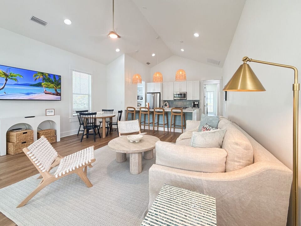 Open-concept living with vaulted ceilings and beautifully refinished finishes throughout