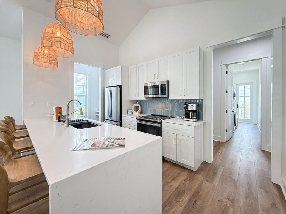 Brand-new kitchen with state-of-the-art appliances, cozy desk nook, and pantry.