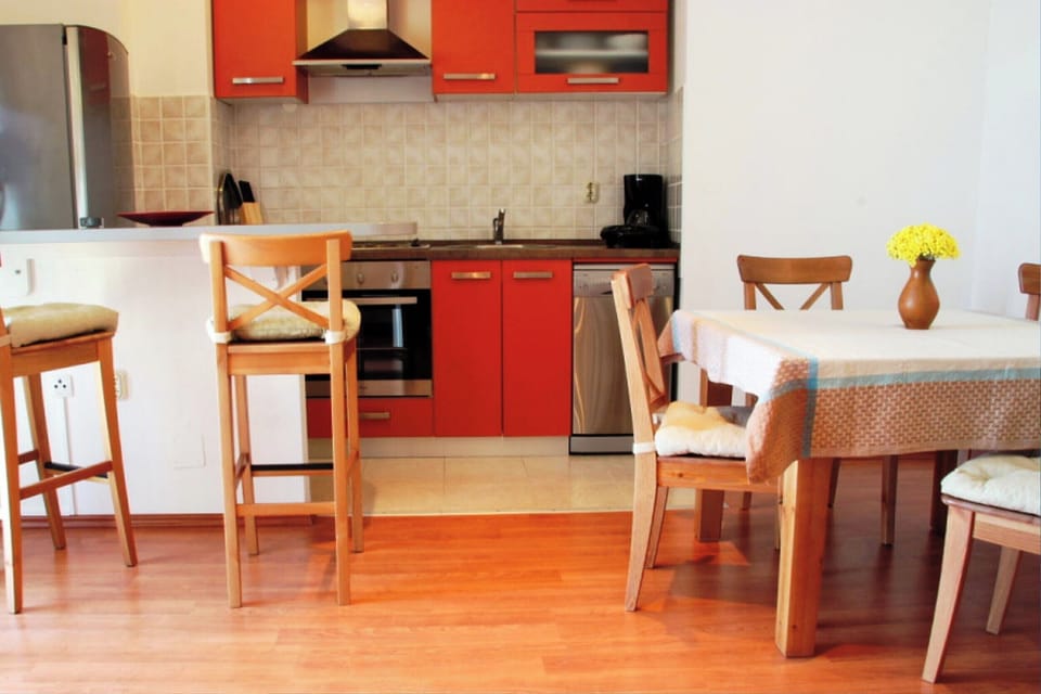 The living room is fitted with both air conditioning and heating systems.