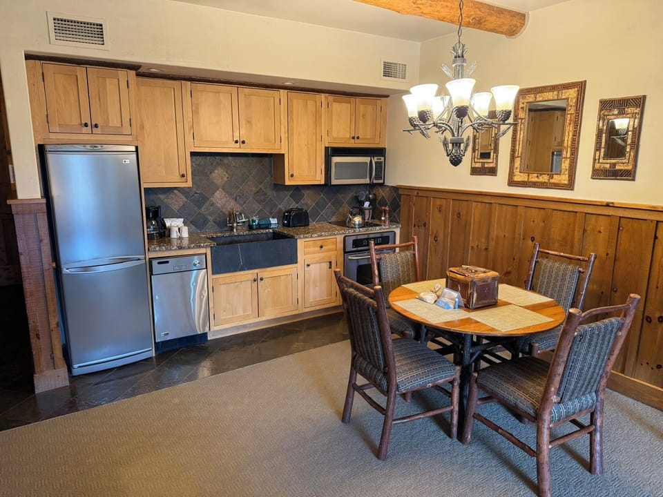 Studio unit also has a kitchen and seating for dining.
