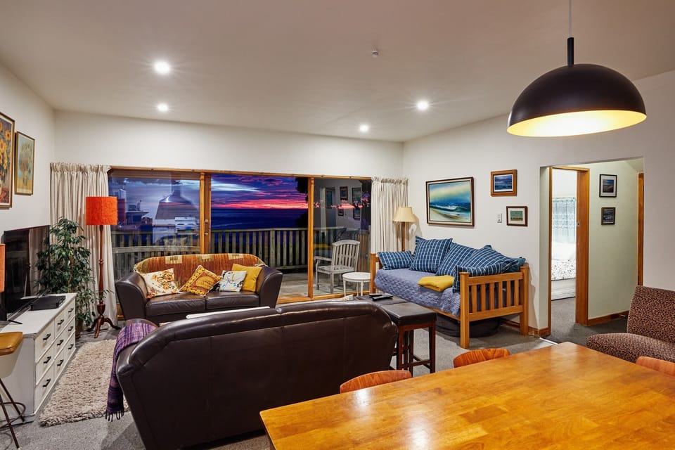 Dining/living areas with sea and mountain views